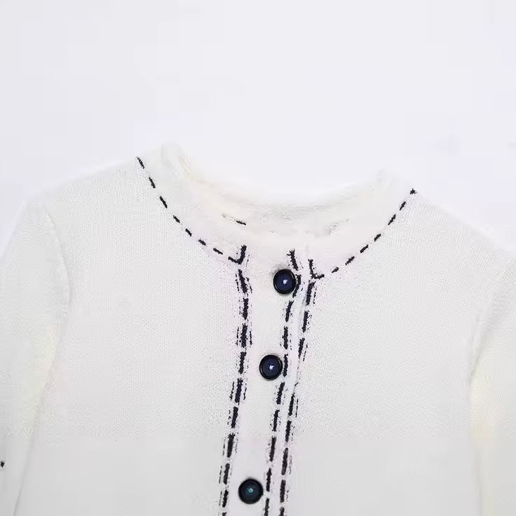 GILET COURT À BOUTONS FACETÉS