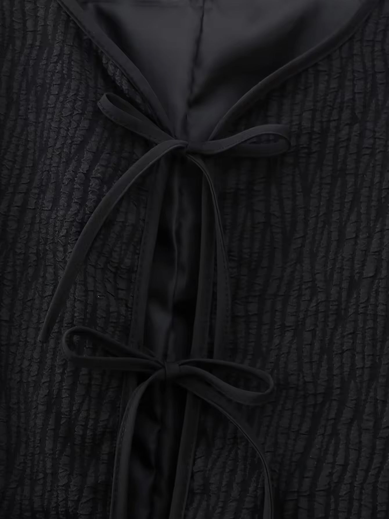 VESTE TEXTURÉE À NOEUDS ET MANCHES PLUMETÉES
