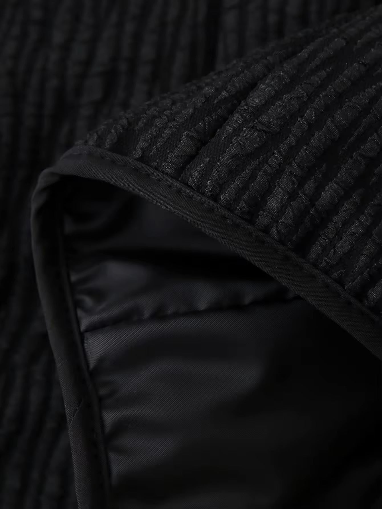 VESTE TEXTURÉE À NOEUDS ET MANCHES PLUMETÉES