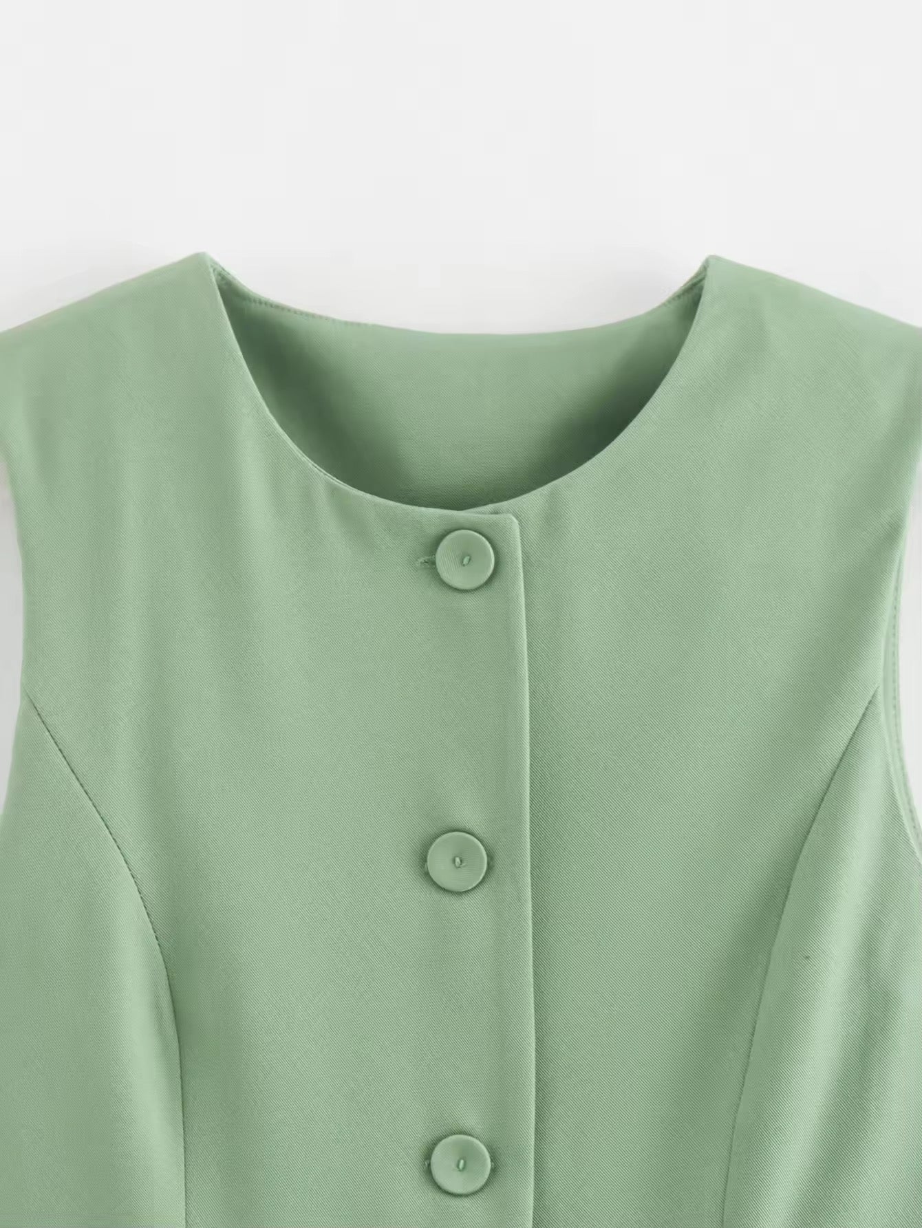 GILET MI-LONG SANS MANCHES