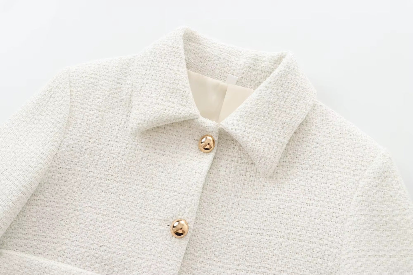 Elegante giacca corta con bottoni dorati