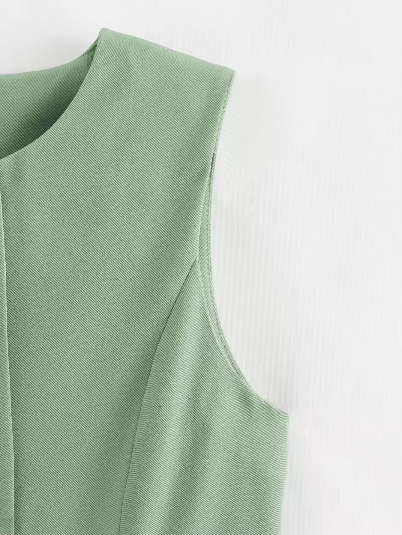 GILET MI-LONG SANS MANCHES