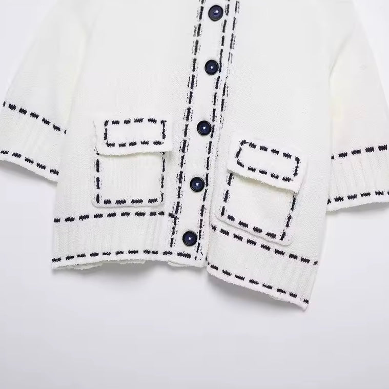 GILET COURT À BOUTONS FACETÉS
