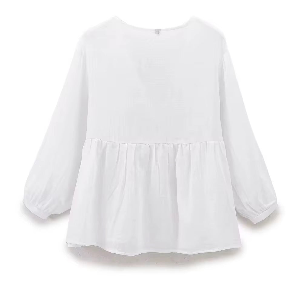 BLOUSE À DÉCOLLETÉ V ET DENTELLE