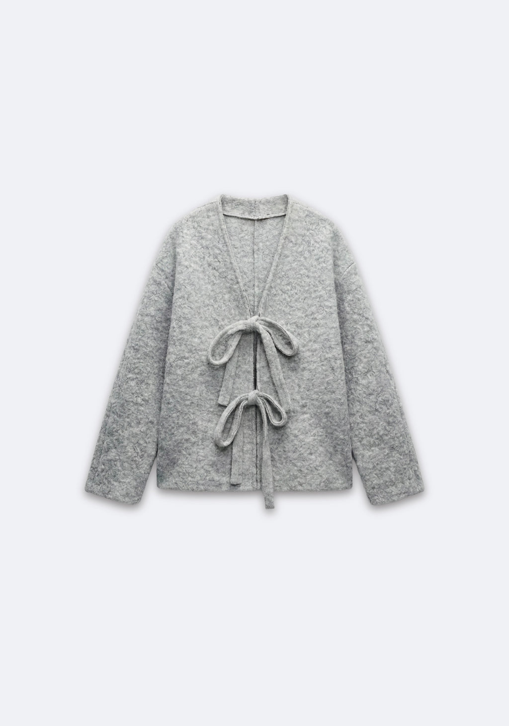 VESTE TEXTURÉE À NOEUDS FRONTAUX