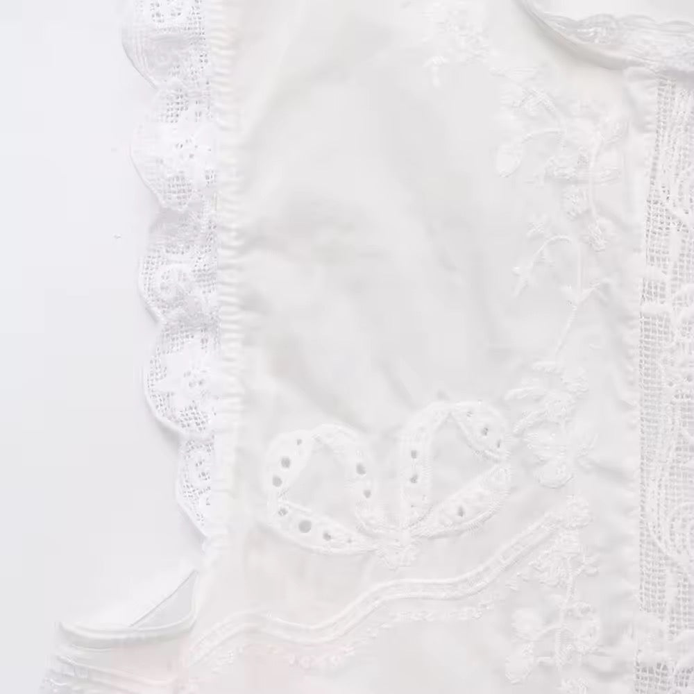 BLUSA CON LACCI RICAMATI