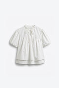 BLOUSE MANCHES BOUFFANTES COL NOUÉ