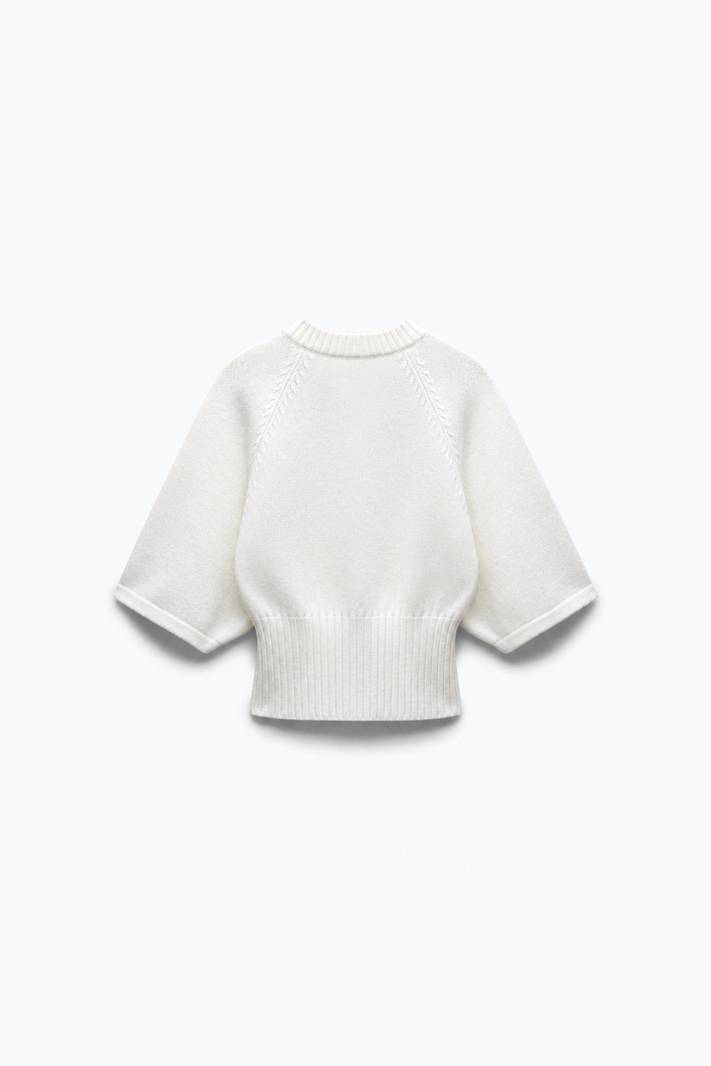 PULL EN MAILLE À TAILLE CINTRÉE