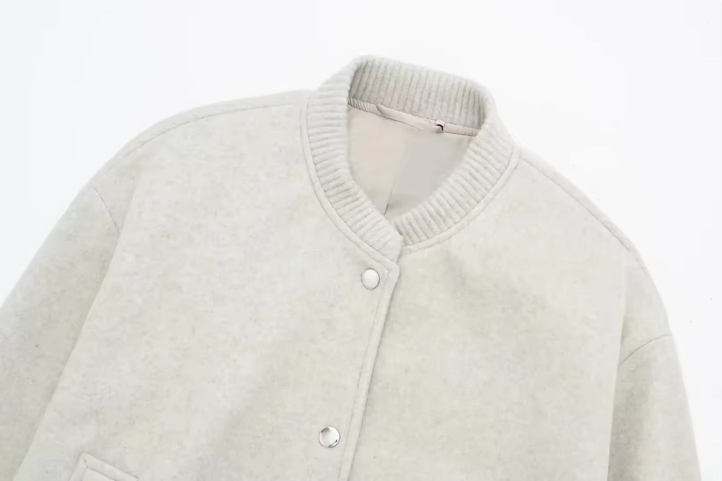 Blouson bombardier court avec bouton métallique