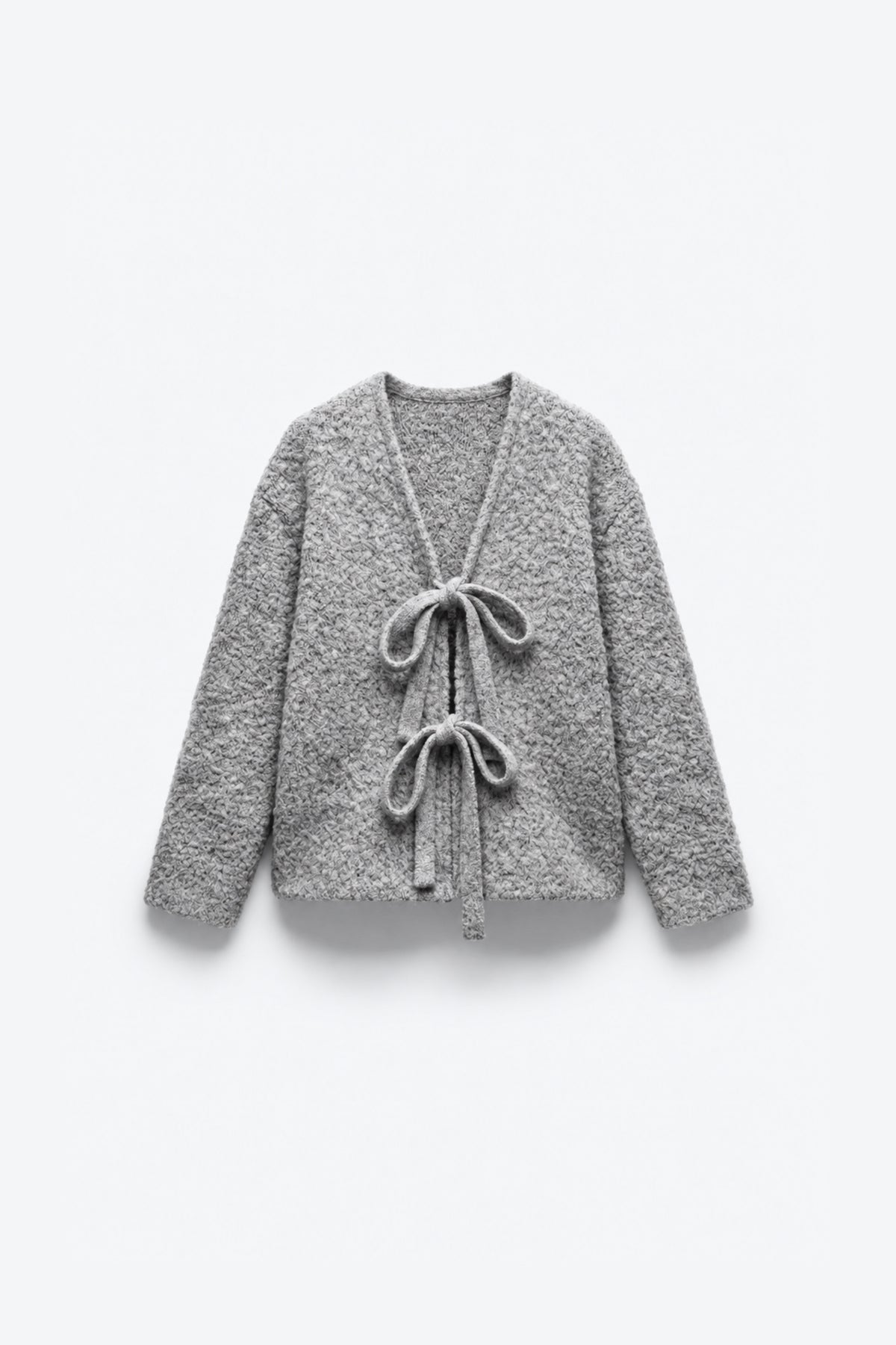GILET EN MAILLE BOUCLÉE NOUÉ
