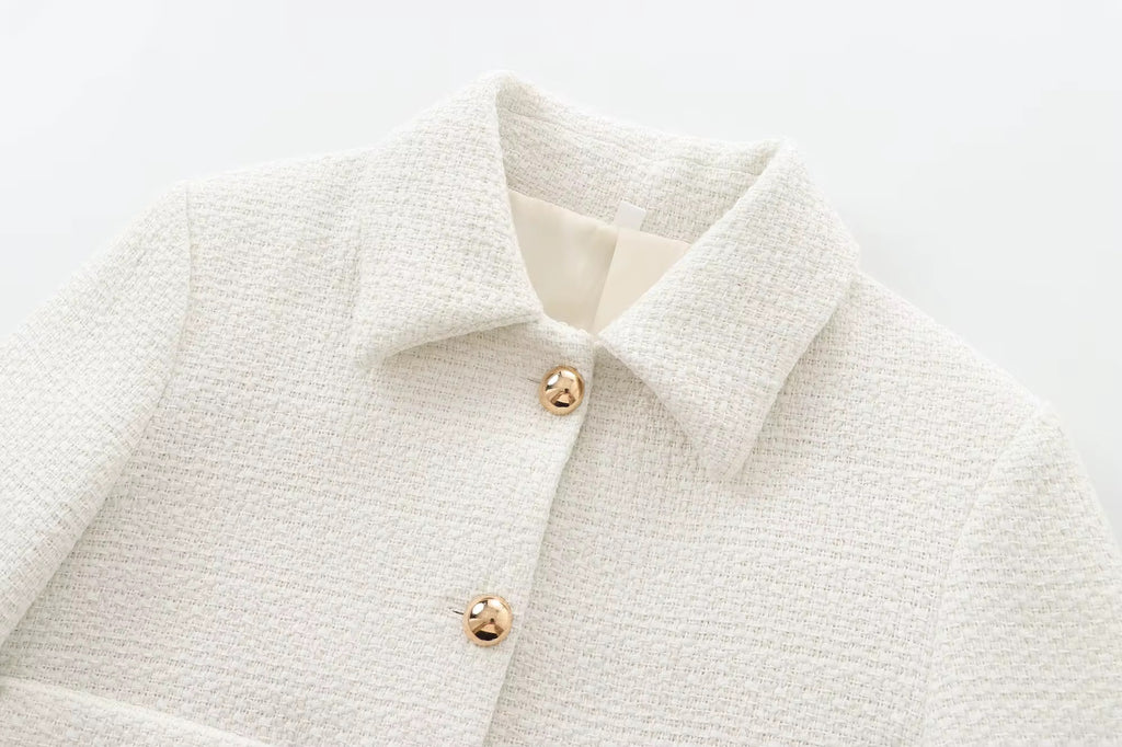 VESTE COURTE STRUCTURÉE À BOUTONS MÉTAL