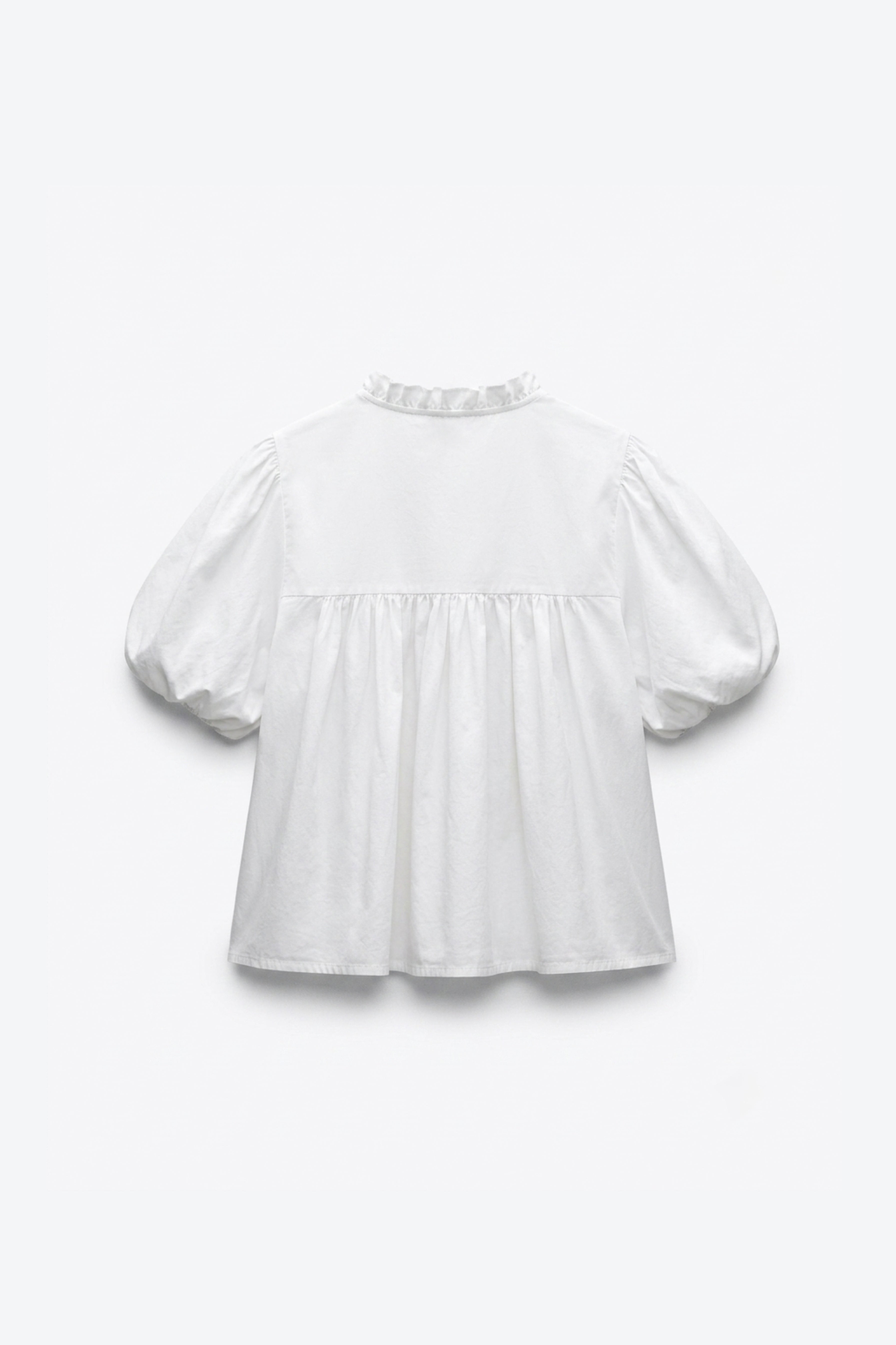BLOUSE MANCHES BOUFFANTES COL NOUÉ