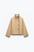VESTE STRUCTURÉE À POINTS DE FESTON
