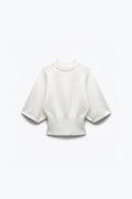 PULL EN MAILLE À TAILLE CINTRÉE