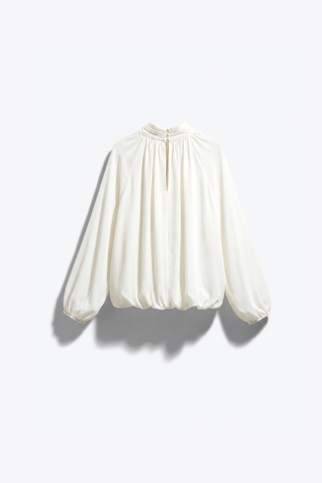 BLOUSE FLUIDE SATINÉE À OURLET BOULE
