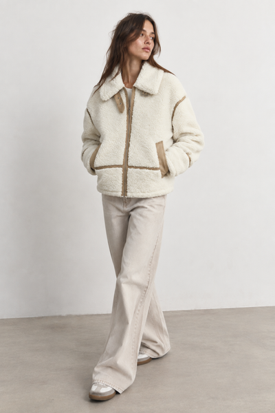 VESTE EFFET LAINE AVEC DÉTAILS CONTRASTÉS