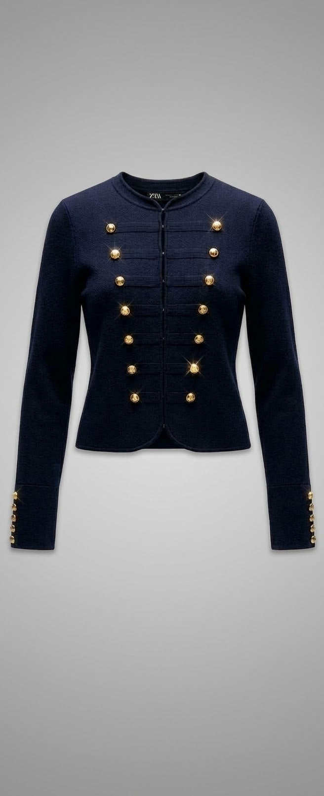 VESTE EN MAILLE À BOUTONS DORÉS