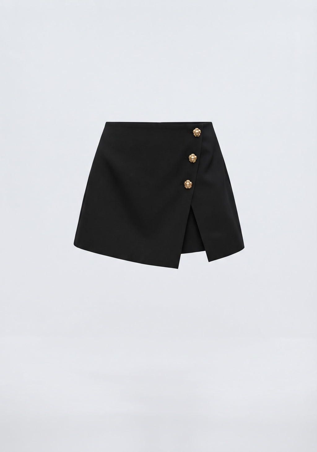 MINI JUPE-SHORT ASYMÉTRIQUE À BOUTONS MÉTALLIQUES