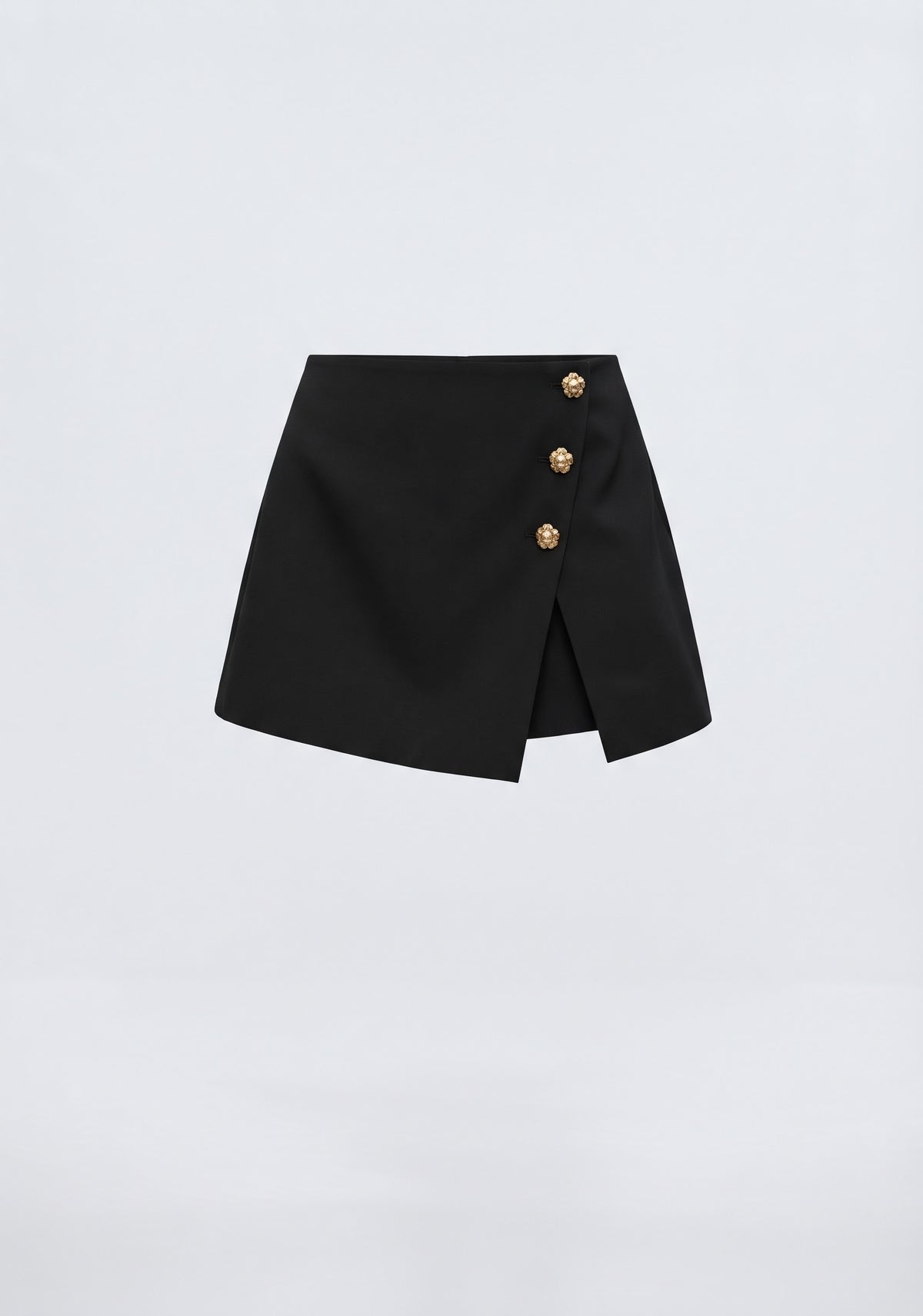 MINI JUPE-SHORT ASYMÉTRIQUE À BOUTONS MÉTALLIQUES